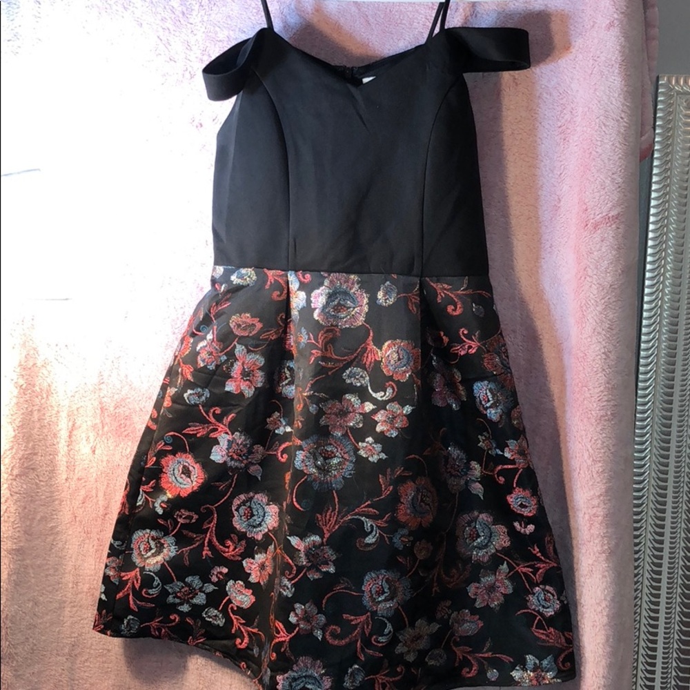 Black dress with embossed floral pattern
